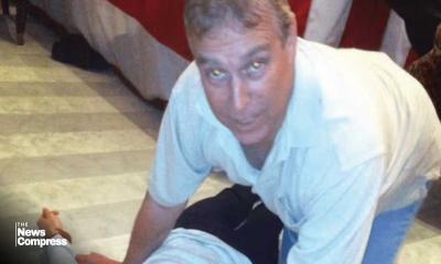 Epstein files: photos appear to show former prince Andrew crouching over woman